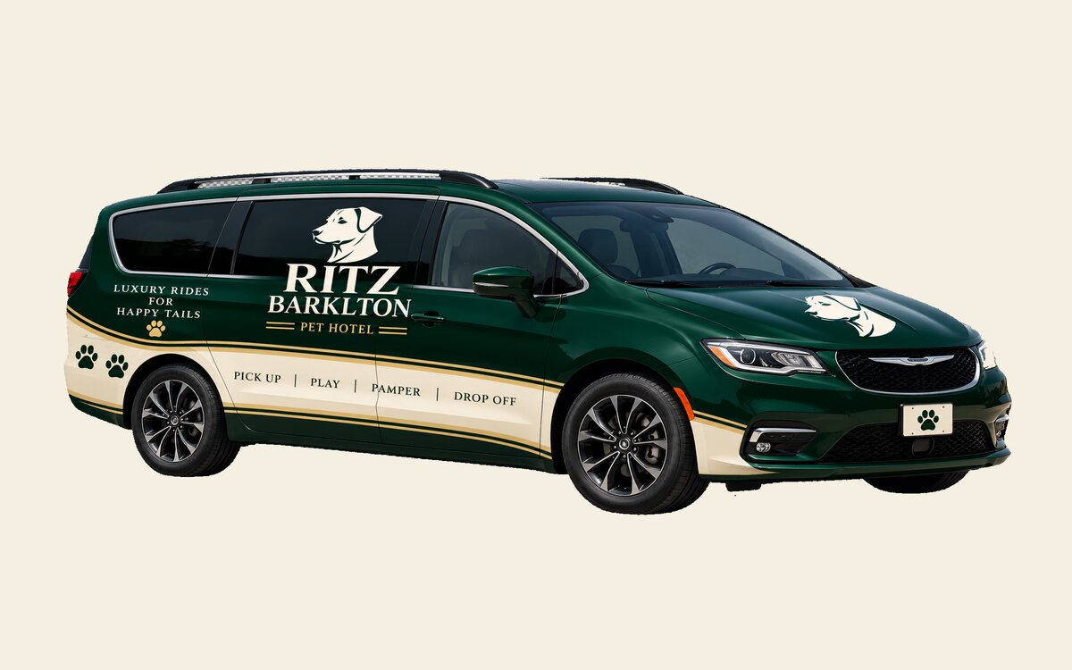 The Barkelton Van, a dark green minivan in resort livery, used for medium and large dog collections